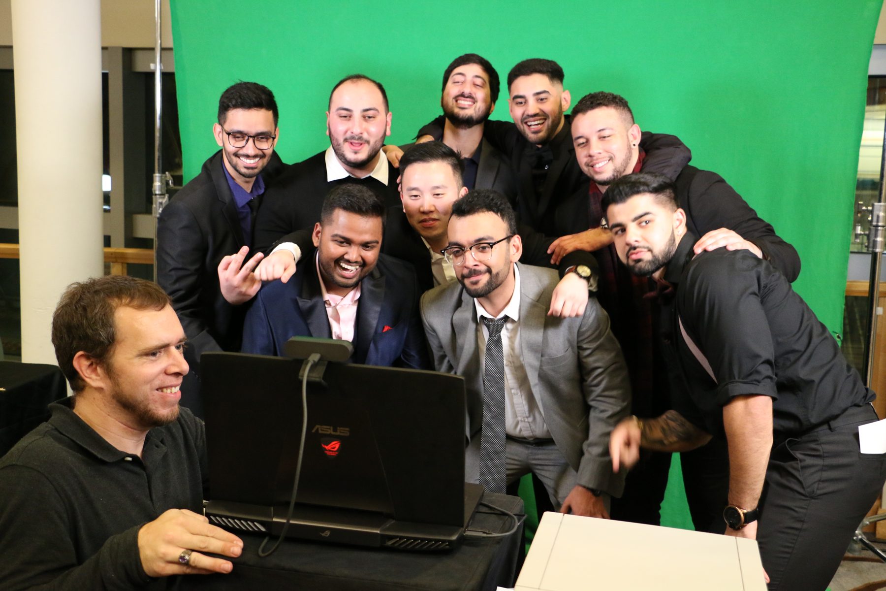 Qualys guests filming a group flipbook on green screen